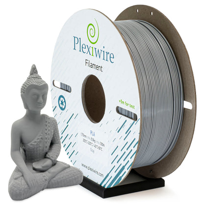 Gray PLA filament Plexiwire 1.75 mm on a cardboard spool with a 3D-printed gold Buddha figurine